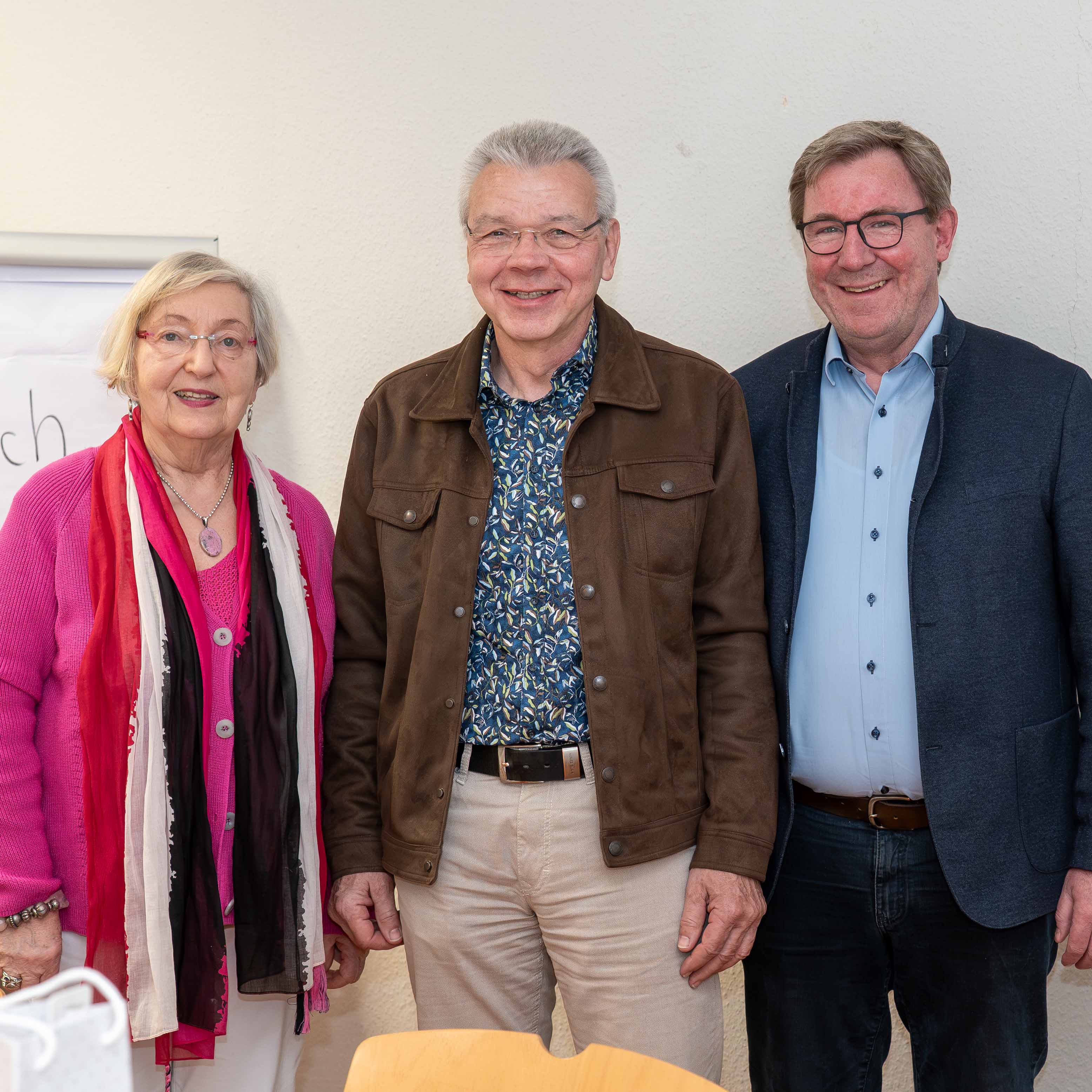 Eine Frau und zwei Männer